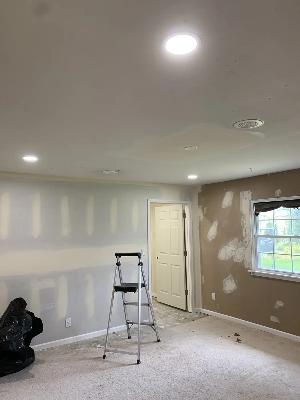 Recessed can lighting installed during a room remodel by Tritan