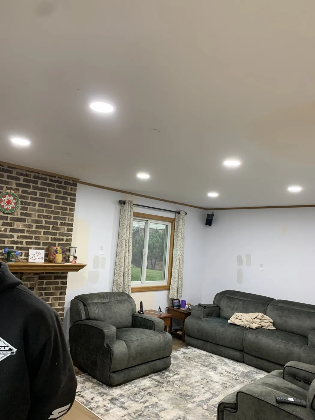 Recessed lighting installed in a family room by Tritan