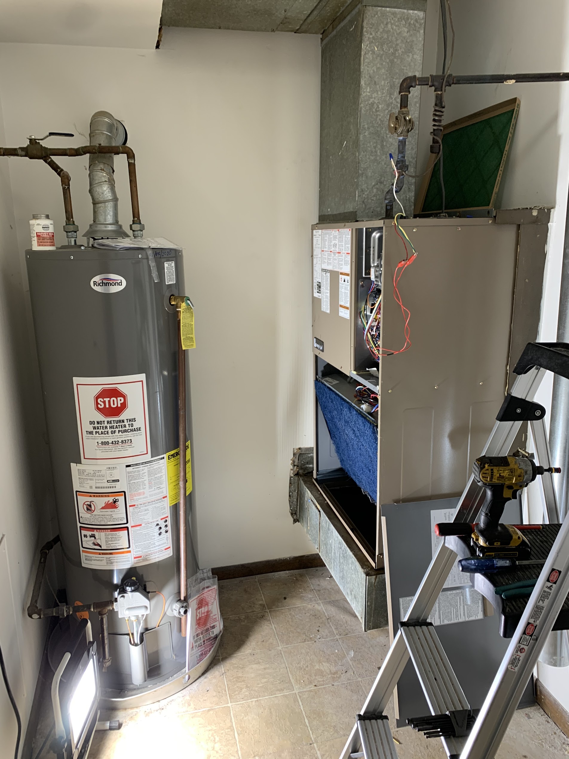 Furnace and water heater pair installed by Tritan in Naperville basement