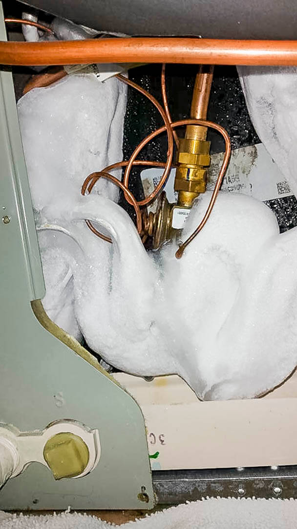Iced-over AC condenser repaired during a Tritan emergency call