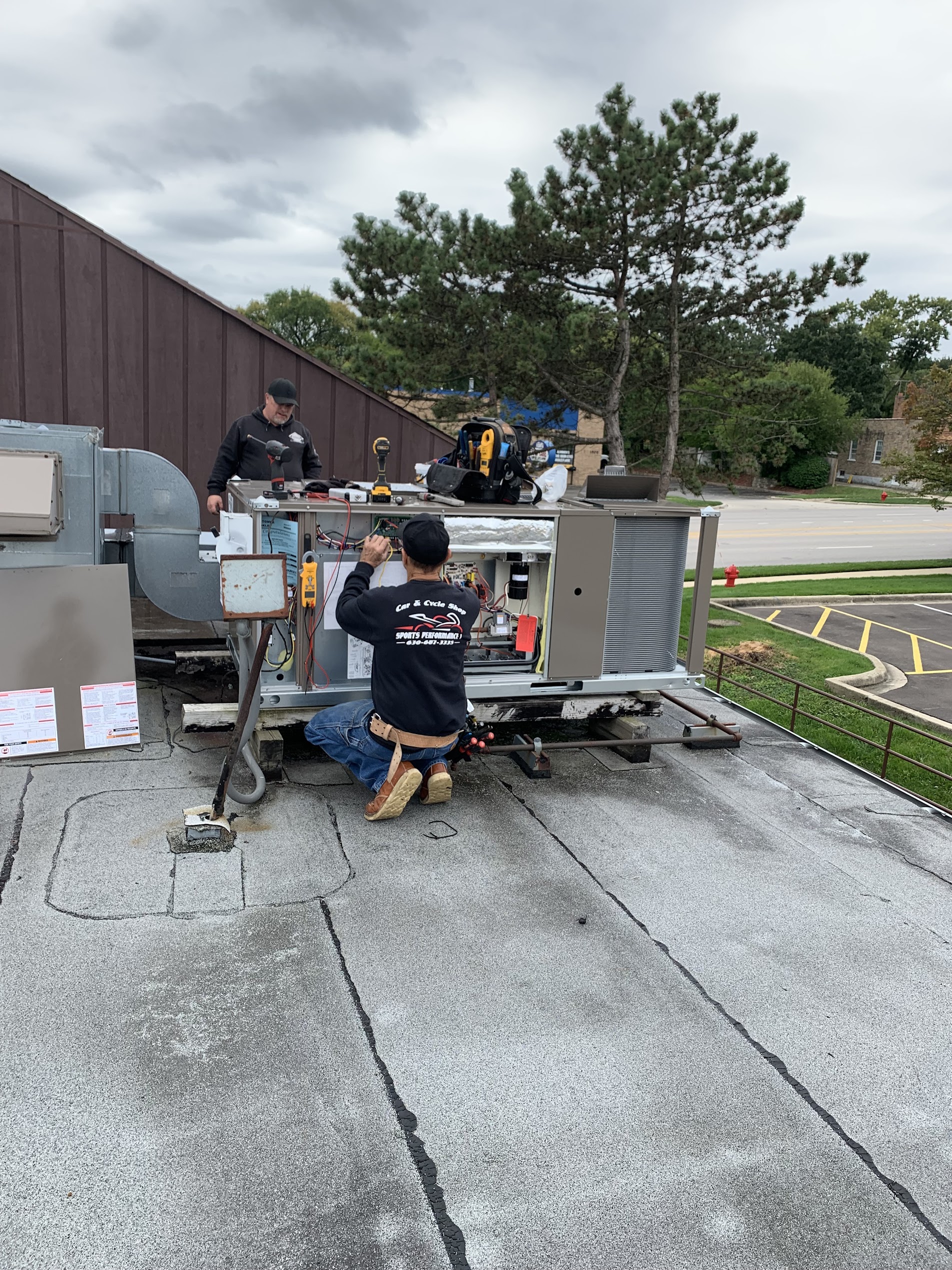 Tritan crew replacing AC condenser at Naperville home