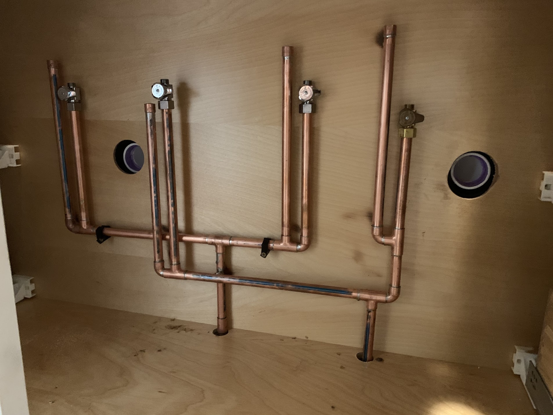Copper supply manifold installed in laundry room by Tritan plumbers